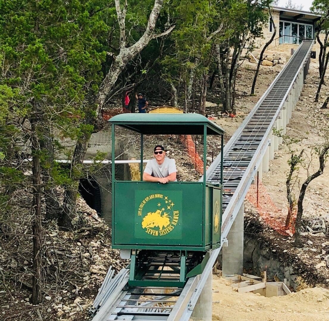 Hill Hiker elevator cable car tram transports passenger safely down hill at Texas ranch property