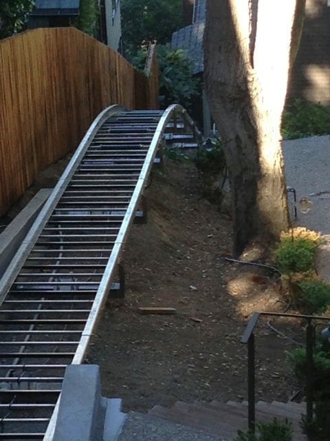Overhead view of custom curved incline lift track that changes degree of incline over length of hill