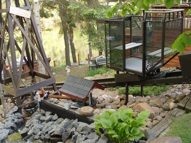 Up north cabin tram lift with fun landscaping and waterfront lake entry